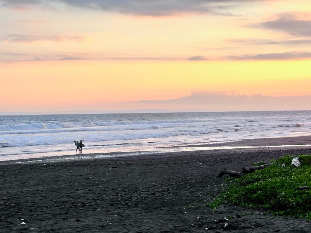 Surfing in Medewi at sunset